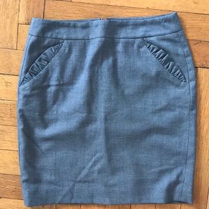 Classic grey pencil skirt w/ ruffle pocket accent!